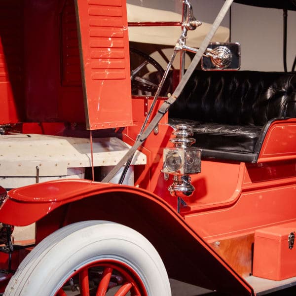 Red touring car, white-wall and brass